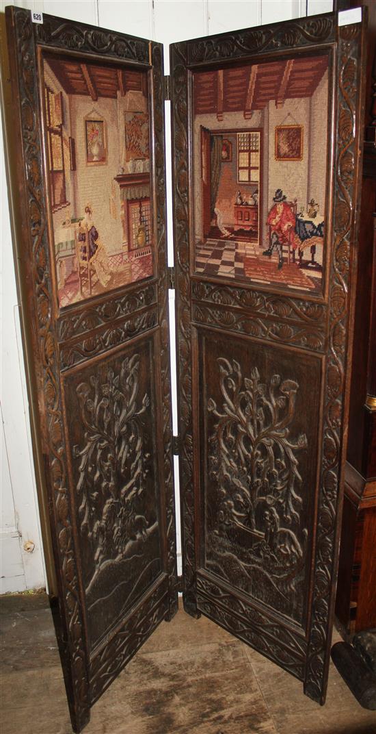 Two fold carved oak screen, inlaid tapestry